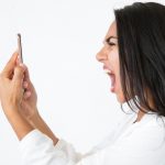 Angry woman responds to telephone scam call.